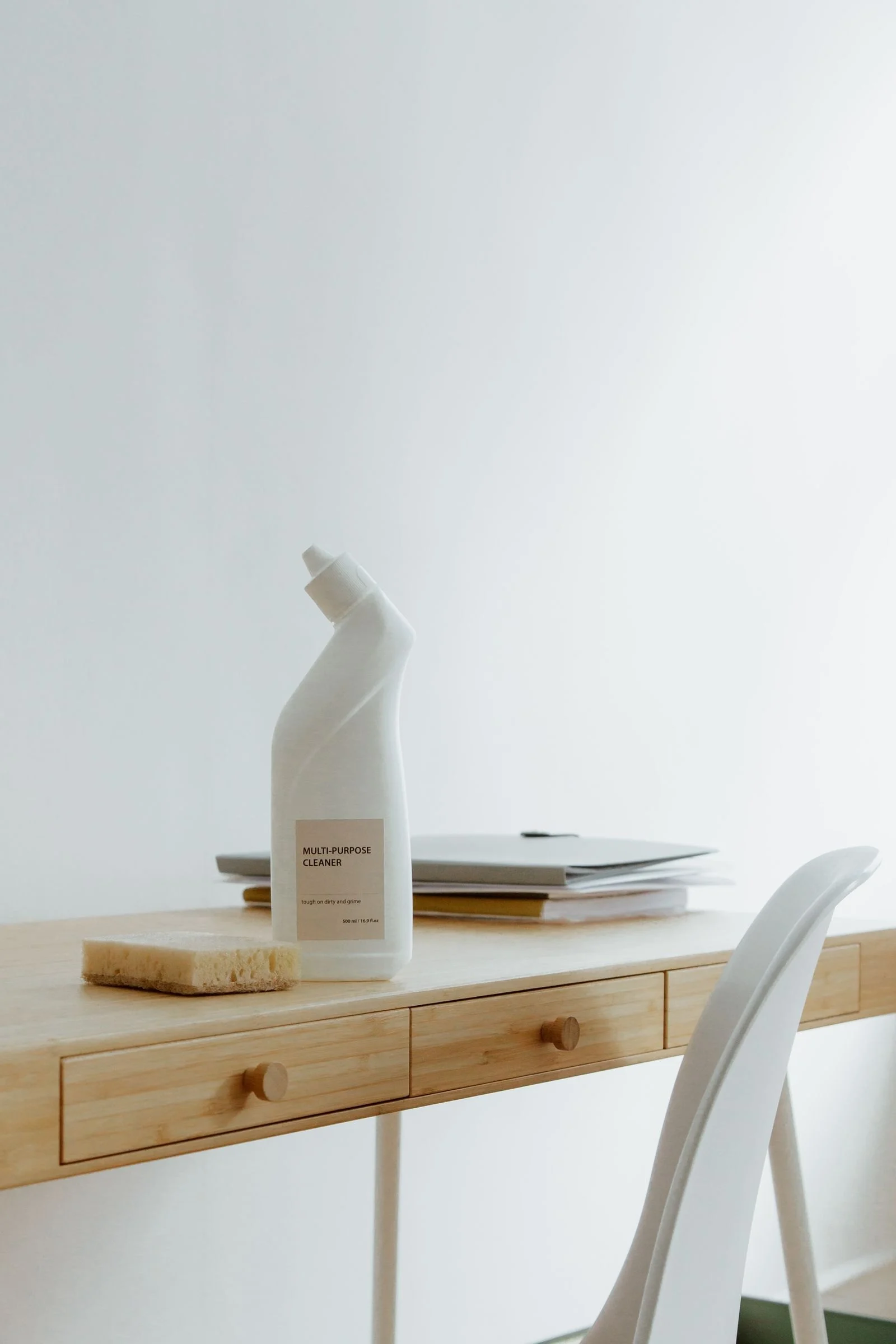 A tidy desk and cleaning supplies