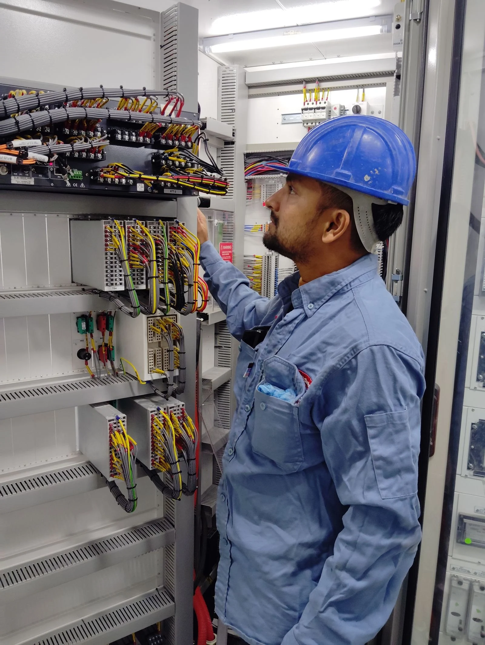 Electrical technician checking cables