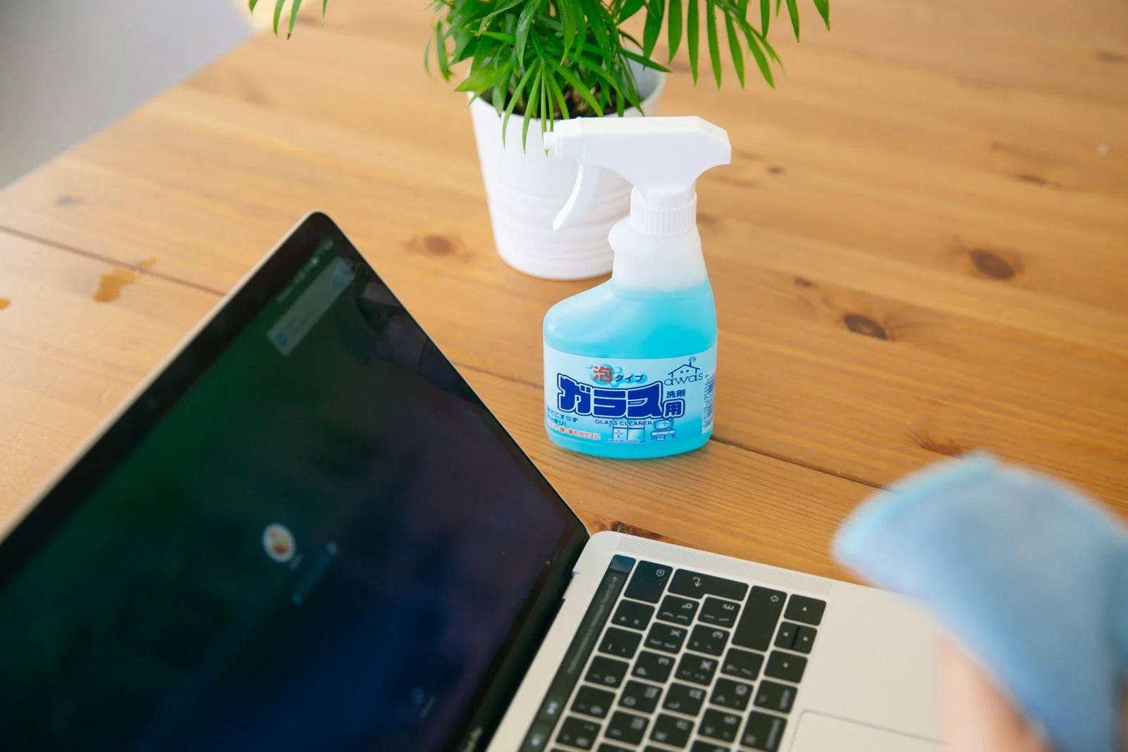 Cleaning spray beside office equipment