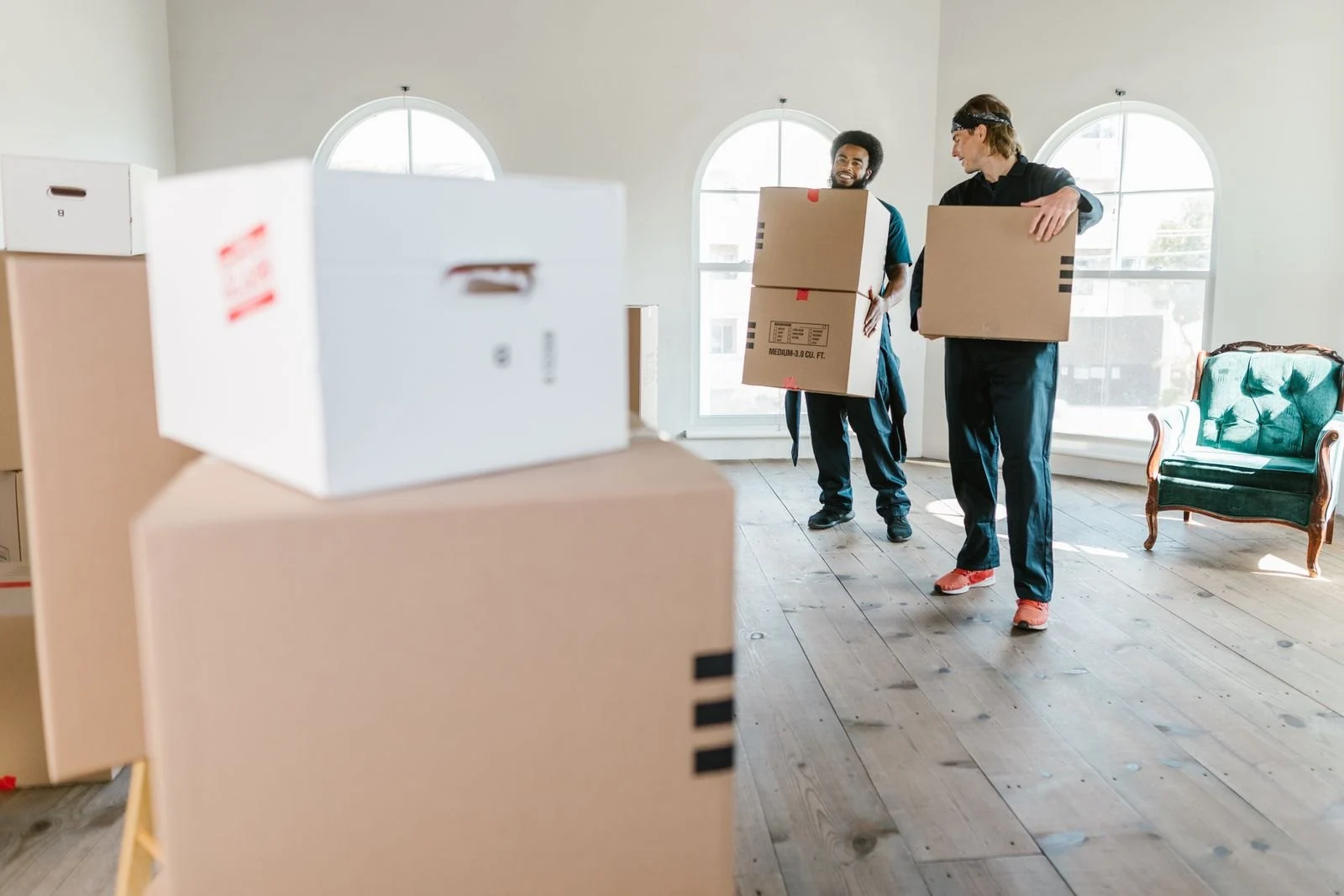 Team handling household boxes